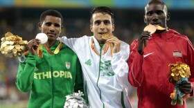 Medalists Tamiru Demisse of Ethiopia (silver), Abdellatif Baka of Algeria (gold) and Henry Kirwa of Kenya (bronze) celebrate after the men's 1500m race in Rio. Their times were all faster than the gold medalist in the same event in the Olympics.