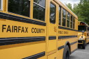 Fairfax County Public School buses sit idle at a middle school in Falls Church, Va., July 20, 2020.