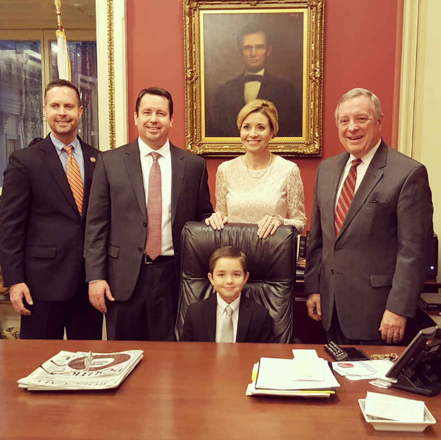 Standing from left: U.S. Rodney Davis, John and Kimberly Wade, U.S. Sen. Dick Durbin. Seated: Jacky Wade