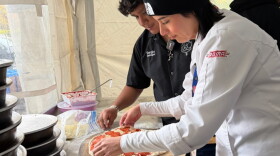 Chef Janet Zapata prepares a pizza at the Pizza Fest Challenge in Montreal.