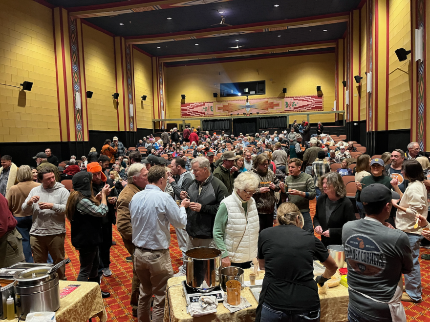 People sample chili made by four Benzie County chefs during a chili cookoff at the Garden Theater in Frankfort, on Nov. 13, 2025. (Photo: Alexandra Herryman/IPR)