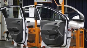 Doors for a Chevy Sonic hang on the assembly line at General Motors' Orion Assembly Plant in Lake Orion, Michigan, in 2011.