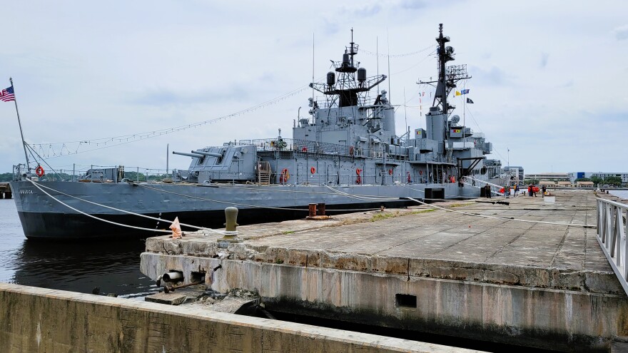 The USS Orleck sits at its new home at Pier 1 on the St. Johns River, after tugboats worked to move it through the silted-up former shipyard basin as tides receded.