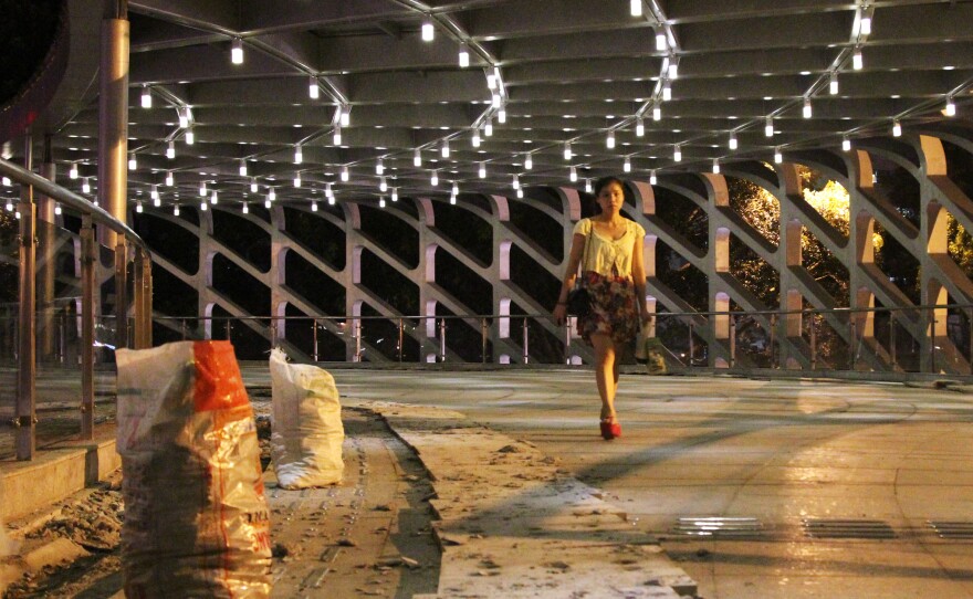 China's government has poured a fortune into infrastructure in part to boost GDP. Not all the money is well-spent. This pedestrian bridge in the Southern boomtown of Shenzhen cost more than $8 million. Less than two years old, it already requires repairs.
