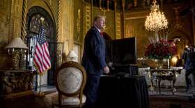 FILE - In this Dec. 24, 2019, file photo President Donald Trump speaks to members of the media following a Christmas Eve video teleconference with members of the military at his Mar-a-Lago estate in Palm Beach, Fla. Congressional Republicans are at a crossroads with Donald Trump. One branch of the party is keeping close to the former president, hoping to harness the power of his political brand for their campaigns. The other is splitting away and trying to chart a post-Trump future. (AP Photo/Andrew Harnik, File)