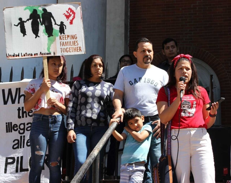 Nelson Pinos, an undocumented father of three, with his family in front of the First and Summerfield United Methodist Church 