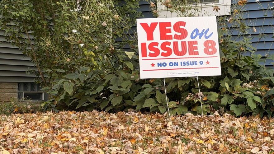 A yard sign in Merion Village tells Columbus voters to vote "yes" on Issue 8 and "no" on Issue 9 in the 2026 election.