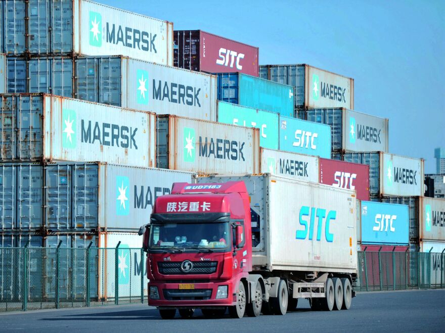 Containers are stacked at the port in Qingdao, in China's eastern Shandong province.