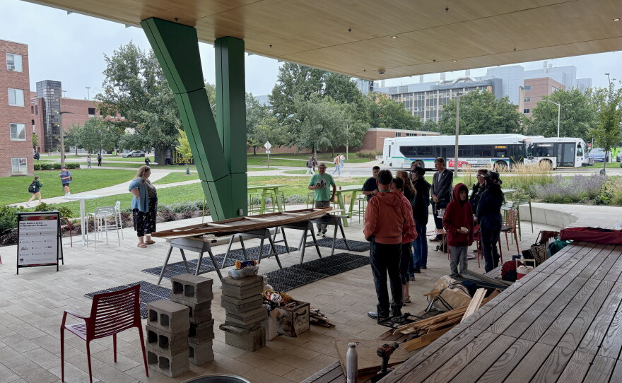 Ron J. Paquin, his apprentices and volunteers building the birch canoe.