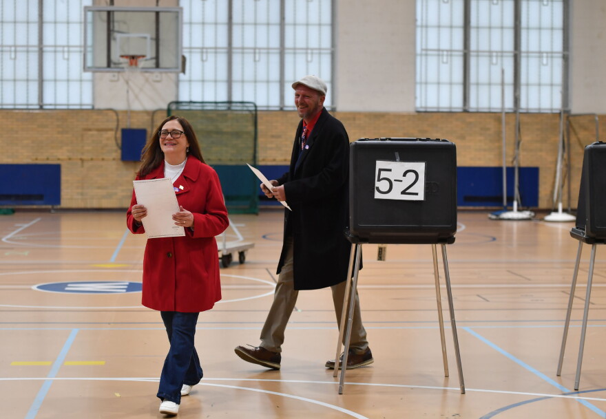 Republican candidate for Scranton mayor Lynn Labrosky finishes voting at the West Scranton High School with her husband Jeff.
