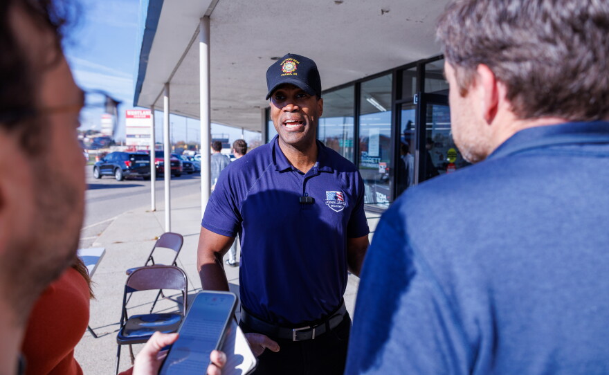 Republican nominee for governor John James speaks to reporters in Lansing Township, Mich., on Oct. 24, 2026, during a stop on Republican U.S. Senate nominee Mike Rogers' "We Have a State to Save" bus tour.