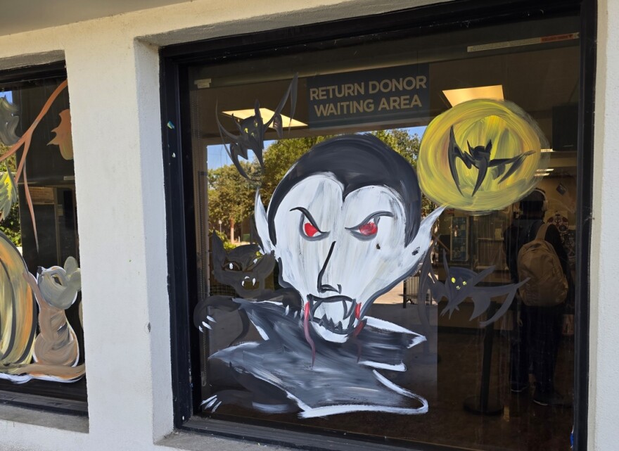 A Halloween window painting of Dracula at a Grifols blood plasma center in downtown San Antonio.