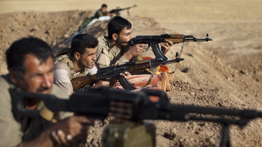 Iraqi Kurdish peshmerga fighters hold a position on the front line in the Gwer district, 25 miles south of Irbil, the capital of the Kurdish region, on Sept. 15. Aided by U.S. airstrikes, the Kurds have been able to retake some positions from the Islamic State.