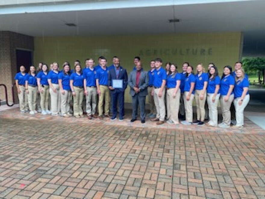 SIU-Carbondale Chancellor Austin Lane and Vice Chancellor for Enrollment Management Wendell Williams join students attending the Illinois F-F-A Association State Officer meeting. The students presented Lane with an Honorary State Degree.