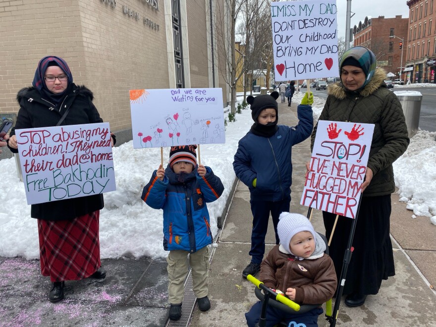Mamadjonova with her sons, Muvahid Madjitov (5), Muhammad Madjitov (8) and Ibrohim Madjitov (2), outside the courthouse.
