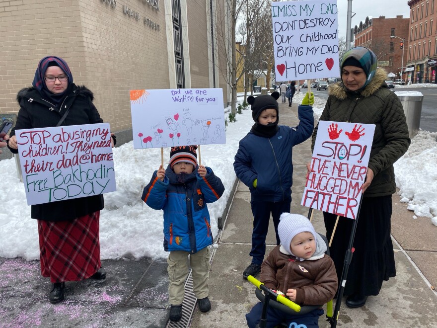 Mamadjonova with her sons, Muvahid Madjitov (5), Muhammad Madjitov (8) and Ibrohim Madjitov (2), outside the courthouse. 