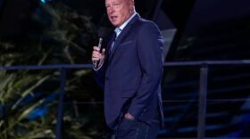  Disney CEO Bob Chapek speaking into a microphone