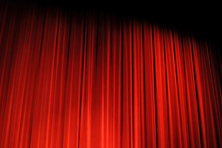Curtain closed on a stage.