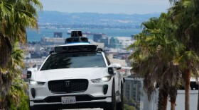 FILE - A Waymo car drives up a hill in San Francisco, Sept. 4, 2025. (AP Photo/Jeff Chiu, File)