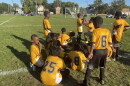 Constance Lane Elementary School's Fourth Grade soccer team huddles up on the side of the field during their game