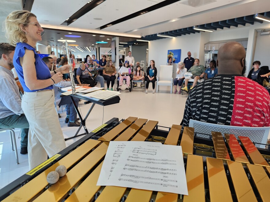 Stroke patients share their favorite songs with the Royal Philharmonic Orchestra prior to a jam session.