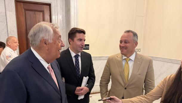 Mass. House Speaker Ron Mariano, Rep. Jack Patrick Lewis, and House Ways and Means Chair Aaron Michlewitz (pictured from left) gather to talk to reporters after a House Democrat caucus on July 15, 2026 at the State House. 