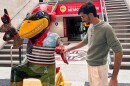 Daniyal Shahbaz, a native of Pakistan, stands next to the Iowa State University mascot inside the school’s Memorial Union building during fall freshman orientation in 2024.