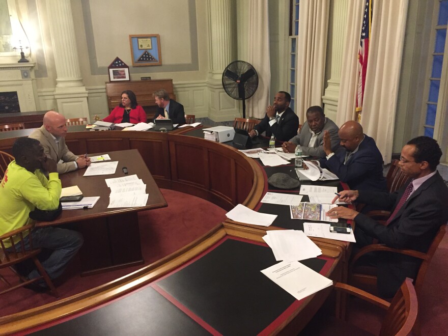 Members of the Hartford Stadium Authority listen to concerns over minority hiring at its new minor league stadium.
