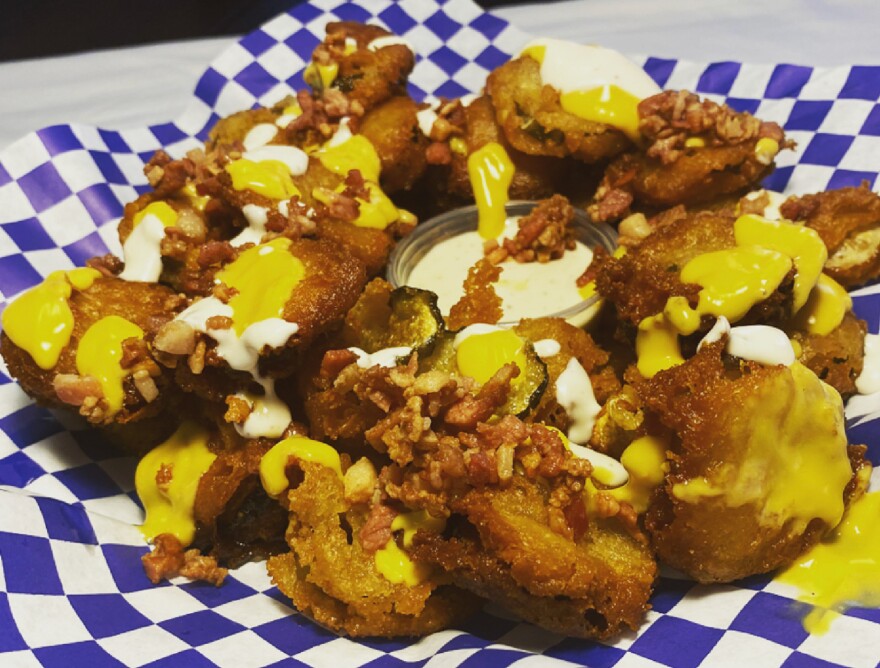 Loaded fried pickle nachos are among the new food offerings at the Florida State Fair for 2022.