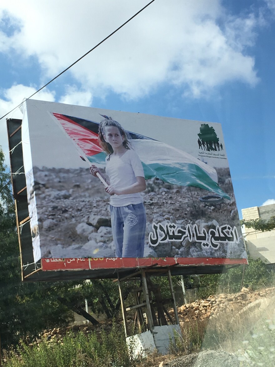 Tamimi has become an icon for many Palestinians. A billboard in Nabi Saleh shows her photo with the words "Go away occupation."