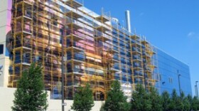 Artist Meg Saligman and her team work on the Fertile Ground mural project in downtown Omaha.