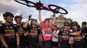 Sepp Kuss of Jumbo-Visma (center) celebrates after winning the Vuelta cycling race in Madrid, Spain. (Manu Fernandez/AP)