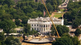 Construction continues on a new helipad on the South Lawn of the White House on July 2, 2026 in Washington, DC. The new helipad is being constructed to accommodate the VH-92A Patriot helicopter that will be used as Marine One, an aircraft that generates significant exhaust heat that would damage the traditional grass landing zone.
