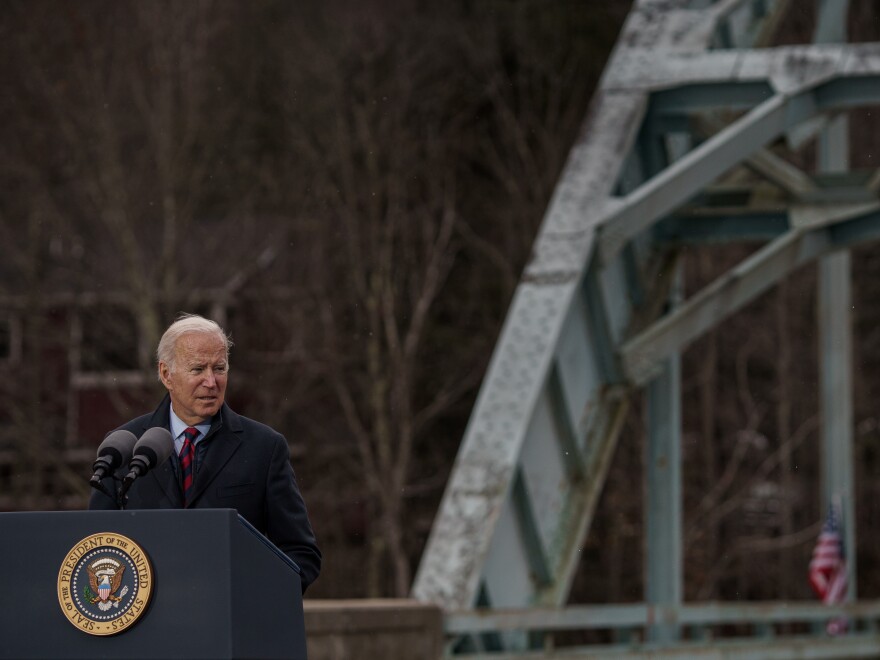 President Biden talks about the infrastructure spending package at an aging bridge spanning the Pemigewasset River in Woodstock, N.H. in November.