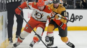 Anaheim Ducks left wing Jeffrey Viel (28) and Vegas Golden Knights right wing Pavel Dorofeyev (16) vie for the puck during the first period of Game 1 of a second-round NHL hockey Stanley Cup playoff series Monday, May 4, 2026, in Las Vegas. (AP Photo/John Locher)