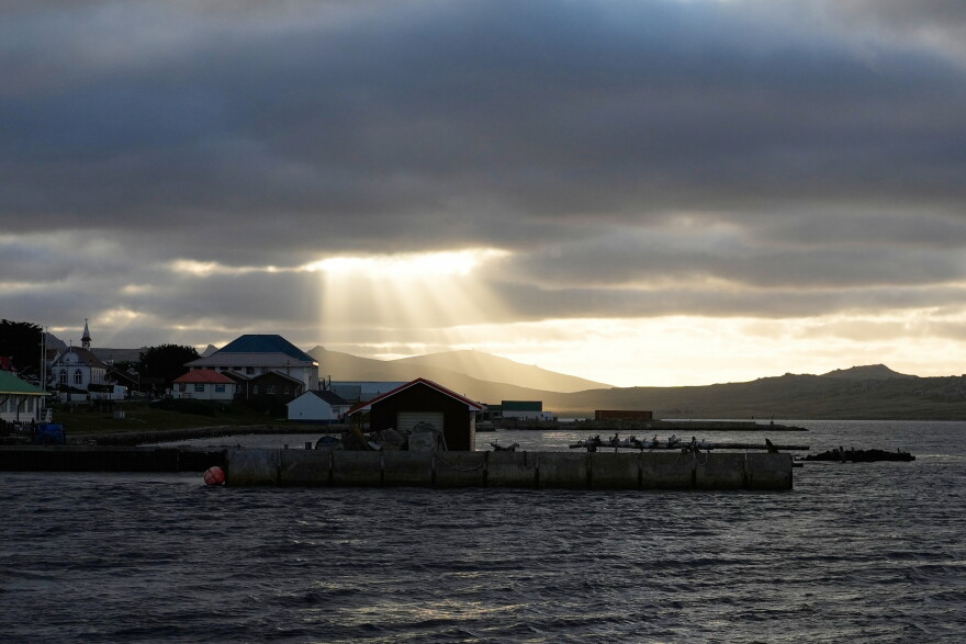 FILE - Sunlight breaks through the clouds over Stanley on the Falkland Islands, also known as Islas Malvinas, March 14, 2026.