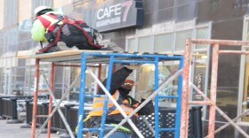 Workers erect scaffolding outside the First National Center building in downtown Oklahoma City.