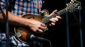 The mandolin is a central of many Bluegrass groups. (Mandolin player with the Jeff Austin Band, on stage at the 80/35 music festival in Des Moines, July, 2016.)