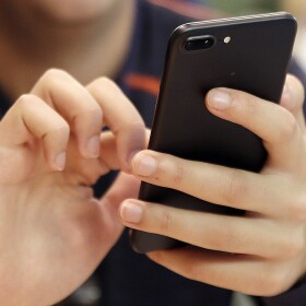 FILE - In this Sept. 16, 2017, file photo, a person uses a smart phone in Chicago. 