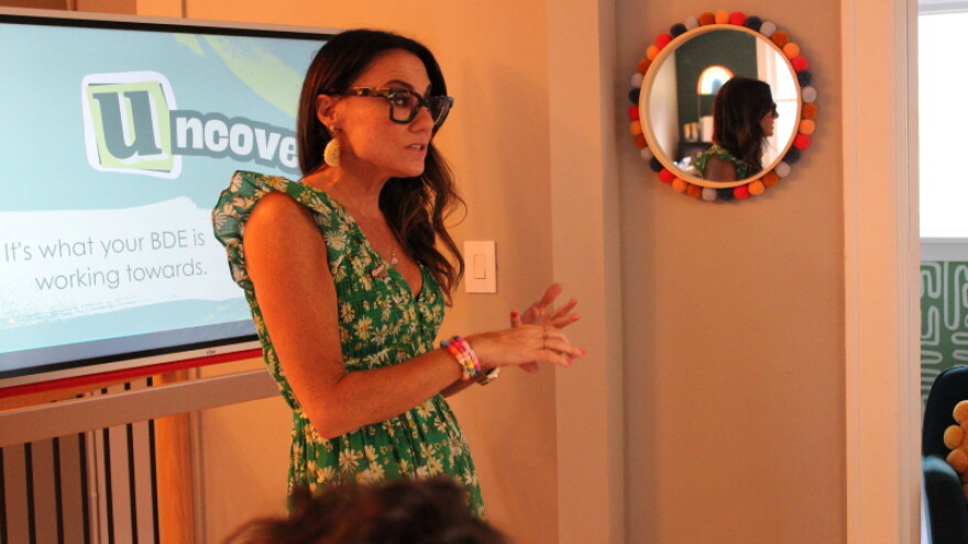Kim Bode speaks to people at a recent event.