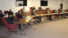 Police and prosecutors in McLean County Board room