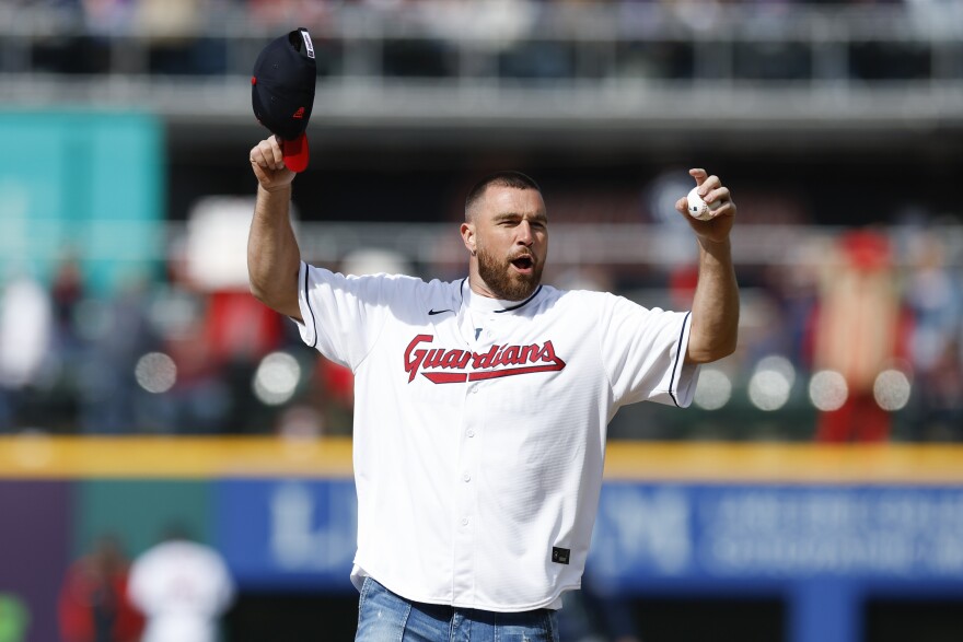 Kansas City Chiefs tight end Travis Kelce prepares to throw out the ceremonial first pitch before a baseball game between the Cleveland Guardians and the Seattle Mariners, Friday, April 7, 2023, in Cleveland.