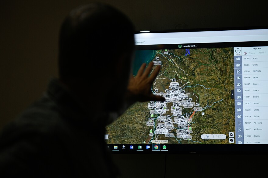 Liwonde field operations manager Lawrence Munro uses the EarthRanger program, which gives enforcement officials a visual representation of snares found in the park over the past month.