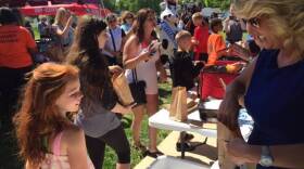 State Rep. Karlee Macer serves meals to children in Indianapolis.