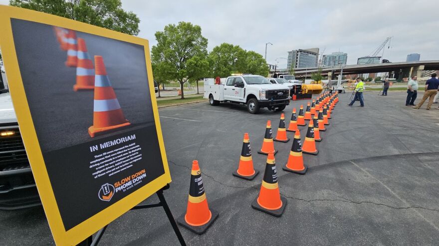 Traffic cones bear the names of Arkansas construction workers killed while on the job on state highways.