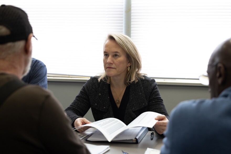 Congresswoman Nikki Budzinski speaks with Calvin Ratliff and Larry Burgan about the long-term effects of radioactive waste in Venice, Ill. on Jan. 12, 2025.
