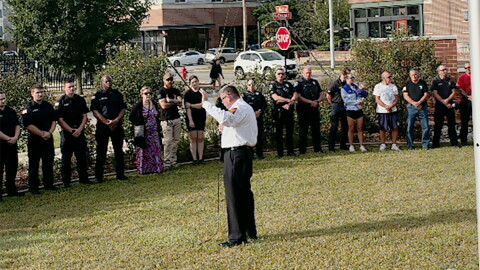 Normal Fire Chief Mick Humer speaks at Friday's remembrance of the 9/11 terror attacks.