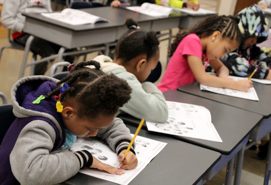 First grade students fill out worksheets at Ingels Elementary School, which recently switched to a year-long model.