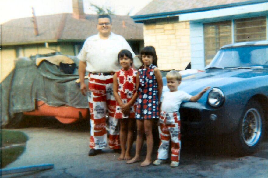 Uncle Paul with his then young nieces and nephew and a couple of his cars at his Bay View home.