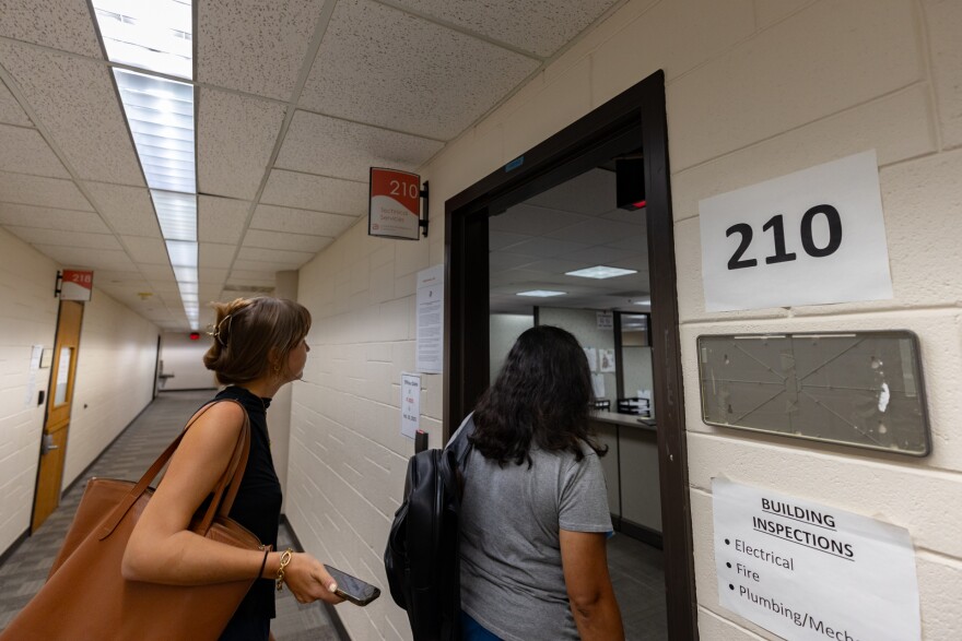 Evelyn Mayo and Janie Cisneros inside the Oak Cliff Municipal Court to file an application for amortization of the GAF Manufacturing shingle factory in West Dallas.